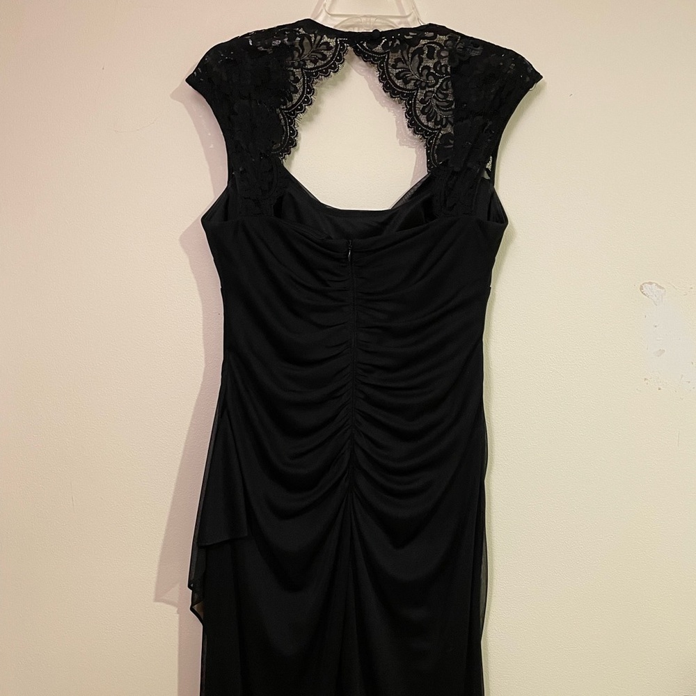 Formal knee length black dress.